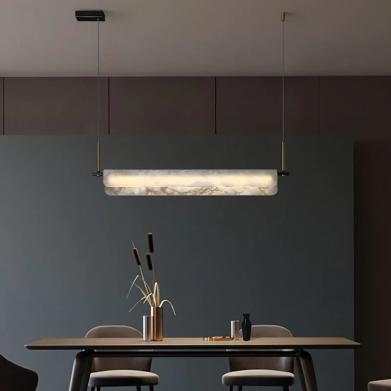 Joisse Alabaster Linear Chandelier Over Dining Room