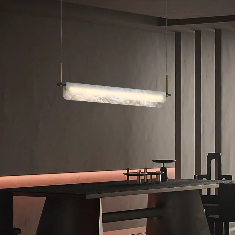 Joisse Alabaster Linear Chandelier Over Dining Room