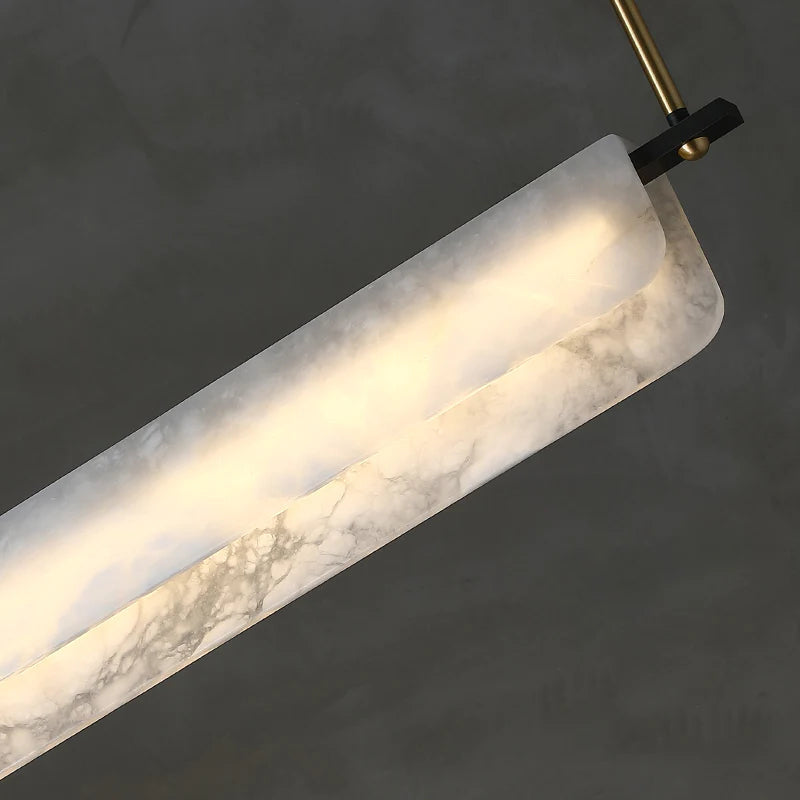 Joisse Alabaster Linear Chandelier Over Dining Room